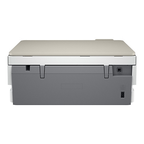Rückseite eines Druckers, grau und beige, mit Anschlüssen. Oben eine beige Abdeckung.