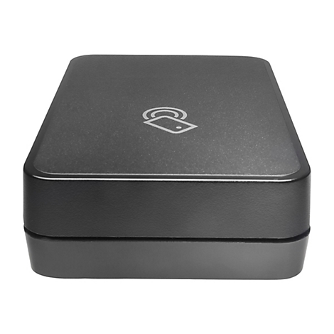 Appareil rectangulaire gris foncé. En haut à gauche, le symbole du paiement sans contact. Appareil sur fond blanc.