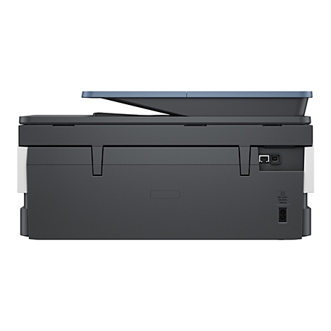 Drucker von hinten, dunkelgrau mit blauem Deckel. Anschlüsse: Ethernet, USB, Strom.