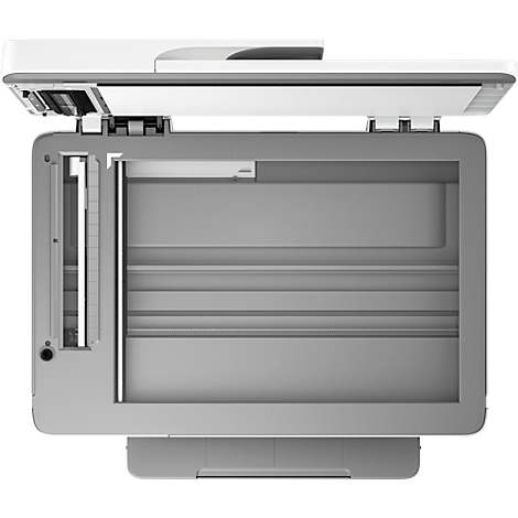 Vue de dessus d'un scanner ouvert avec le couvercle relevé. L'intérieur du scanner est gris, le couvercle est blanc.