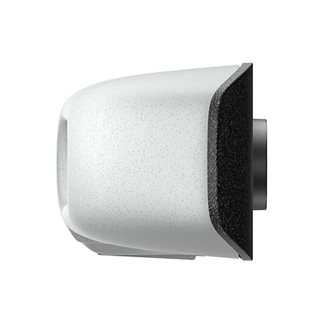 Ein abgerundetes, weißes Gerät mit einer strukturierten Oberfläche, rechts ein schwarzes, strukturiertes Element und ein grauer Zylinder. Die Oberfläche ist mit kleinen Punkten versehen.