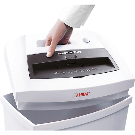 A hand lifts the top of a white paper shredder, with the collection bin below. The shredder says SECURIo C14.