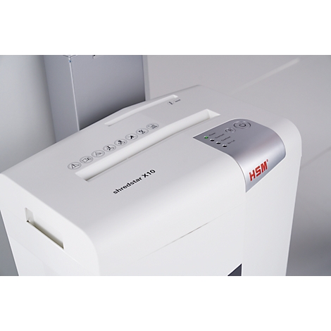 A white paper shredder with a control panel at the top showing symbols and the text "shredstar X10".