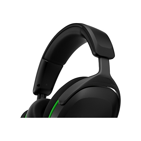 Gros plan d'un casque circum-auriculaire noir avec des accents verts sur fond blanc.