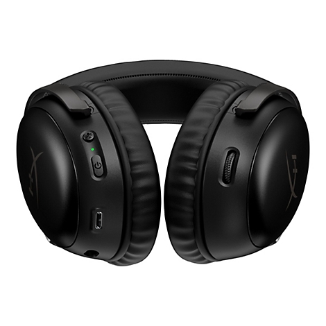 Schwarzes Gaming-Headset. Auf der rechten Seite befindet sich ein Einstellrad, links ein Mikrofon-Symbol und eine grüne Betriebsanzeige. Auf weißem Hintergrund.