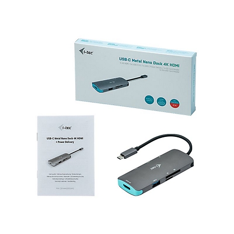 USB-C Metal Nano Dock 4K HDMI avec boÃ®te et manuel. Le dock est gris, la boÃ®te est blanc-bleu avec le nom du produit. DÃ©tails du dock.