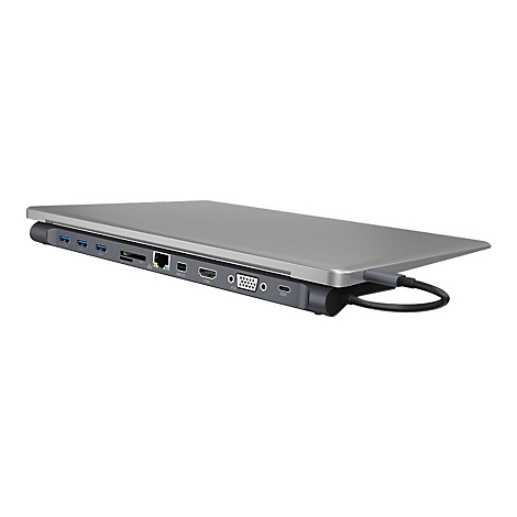 Ein silbernes Laptop-Dock mit verschiedenen AnschlÃ¼ssen: USB, HDMI, Ethernet. Ein Kabel ist eingesteckt.