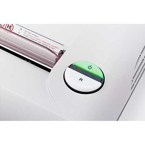 Close-up of a white paper shredder with highlighted on/off button. The button is bi-colored, green illuminated on top, white on bottom with 'R'.