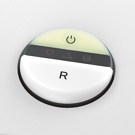Close-up van een rond, verlicht bedieningspaneel met symbolen en de letter R.