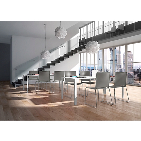Modern dining area with tables, chairs, stairs, and large windows. Bright, minimalist interior with a view of a skyline.