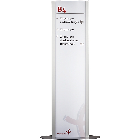White signpost with directions: B4, room numbers, elevators, station room, WC symbol. Red logo at the bottom.