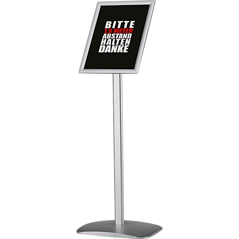 A silver-colored stand with a black sign that reads "Please keep a distance of 1.5 meters. Thank you" in white letters.