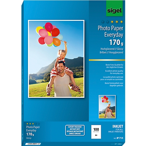 A man carries a child on his shoulders. Both are holding colorful balloons in the air. The packaging says 'Photo Paper Everyday'.