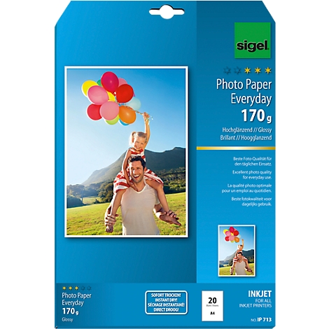 A package of photo paper shows a child on a man's shoulders with balloons. Inscription: Photo Paper Everyday.