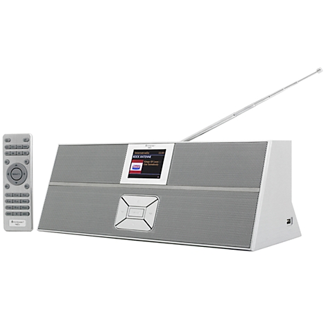 Gray radio with remote control. Antenna extended, display with text. Button below, remote control beside it.