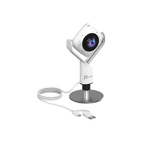 Une webcam blanche, carrée avec un objectif rond, est posée sur un socle avec des câbles. La caméra indique "MODE".