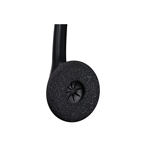 Gros plan d'un casque noir avec un coussinet d'oreille rond et granuleux.