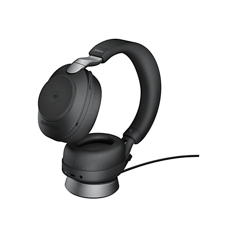 Casque Jabra noir. Sur socle gris avec câble. Oreillettes et arceau rembourrés.