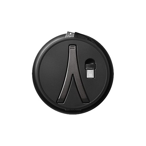 Un gadget noir et rond avec un support en métal et une connexion USB. À l'intérieur, une connexion USB-C.
