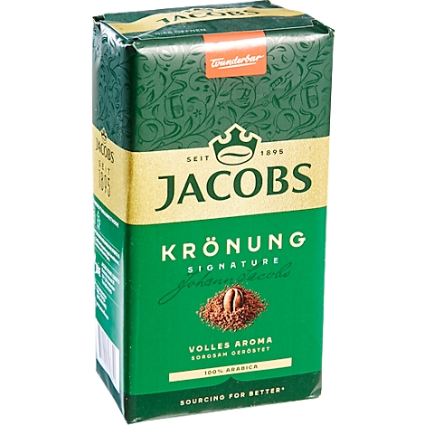 Groene Jacobs Krönung koffieverpakking met tekst. Rood label bovenaan, gouden gedeelte met logo en belettering, koffiebonen illustratie eronder.