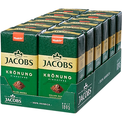 Display van Jacobs Krönung koffiepakketten. Groen en goudkleurige verpakking met de tekst: Jacobs Krönung Signature, 100% Arabica.