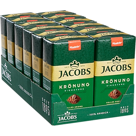 Jacobs Krönung koffiepakketten. Verschillende pakjes in een doos, groen design met gouden letters.