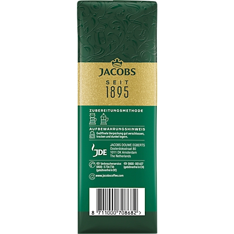 Grüne Kaffeeverpackung mit goldenem Streifen und Aufschrift JACOBS SEIT 1895. Enthält Zubereitungshinweise und Kontaktinformationen.