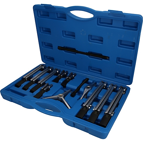 Mallette à outils bleue contenant divers composants d'extracteur en métal dans des emplacements moulés.
