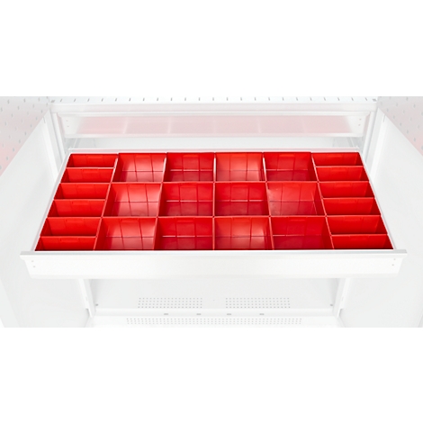Tiroir rouge avec compartiments, dans une armoire blanche. Bien adapté à l'organisation de petites pièces.