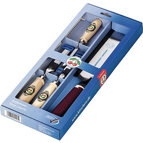 Ensemble de ciseaux dans une boîte bleue. Manches en bois avec logo cerise, éléments rouges et argentés. Le texte 'Kirschen' est visible.