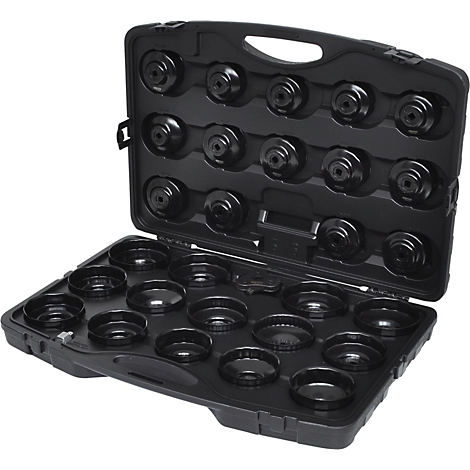 Boîte à outils noire, ouverte, remplie de clés à filtre à huile noires de différentes tailles.