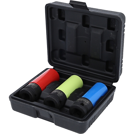Une boîte à outils noire contenant trois douilles colorées. Rouge, jaune et bleu.