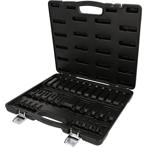Mallette à outils vide en plastique noir avec inserts moulés sur mesure et deux fermetures métalliques.