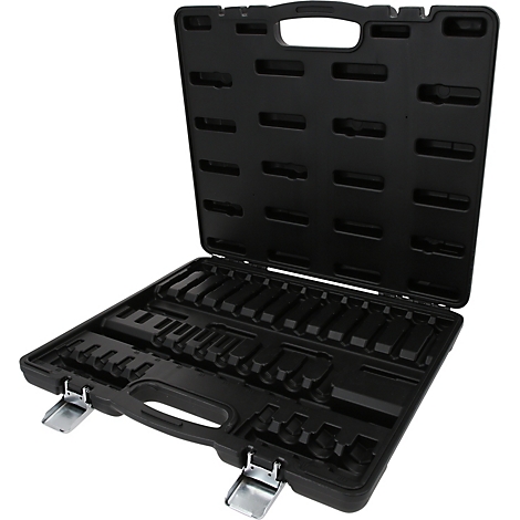 Mallette à outils vide en plastique noir, ouverte, avec des compartiments moulés et des fermetures métalliques argentées.
