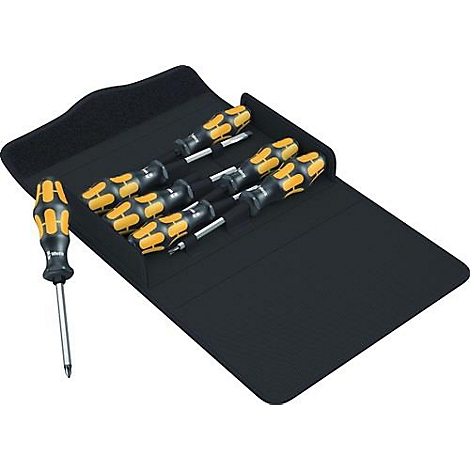 Jeu de tournevis dans un étui noir avec fermeture Velcro, un seul tournevis est à côté.