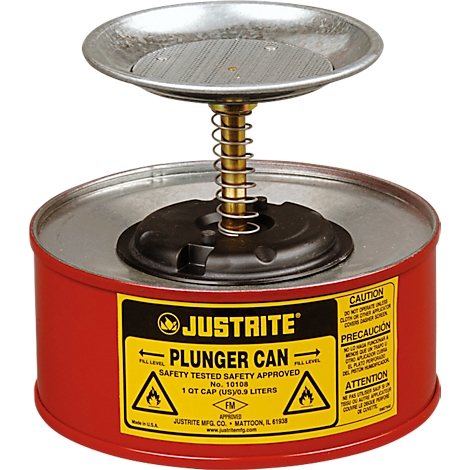 Red container with metal plate and spring. Yellow sticker with text and fire hazard symbols.