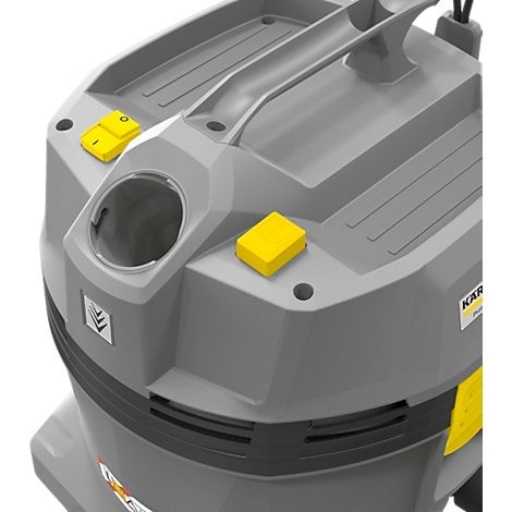 Gray vacuum cleaner lid, two yellow buttons, an opening, and a carrying handle.
