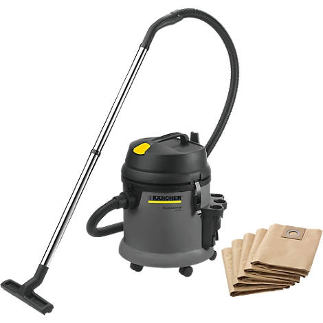 A grey Karcher vacuum cleaner with accessories, consisting of hose, suction tube and bags. Next to it are spare bags.