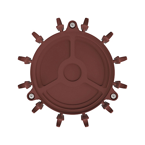 Bruin ronde afdekking met meerdere kleine cilindrische uitlaten. Centrale cirkelvormige uitsparing met radiale verstevigingen.