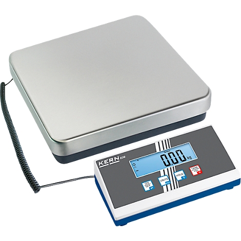 Une balance numérique pour colis affichant 0,00 kg. La balance a une surface de pesée argentée et un panneau de commande gris avec un écran bleu.