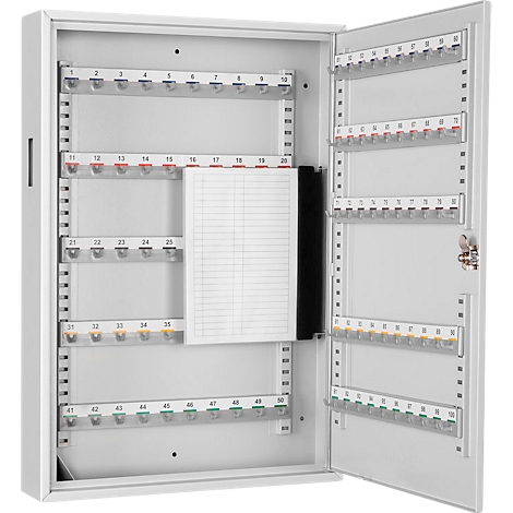 White key cabinet with open door, numbered hooks and notepad.