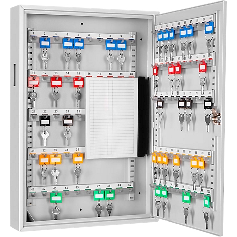 Open key box with many keys and colored tags. Numbers can be seen on the tags. A notepad is located inside.