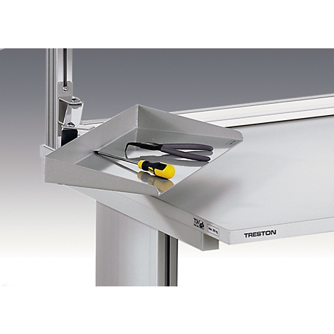 Metal shelf with tools on a workbench. It shows a screwdriver, pliers and the inscription Treston.