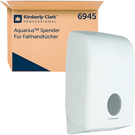 Witte papieren handdoekdispenser naast een kartonnen doos met opdruk.
