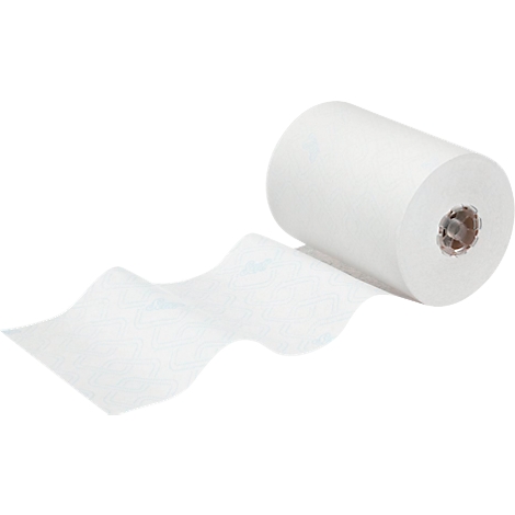 Een witte papieren rol met papier dat eruit komt. De kern van de rol is zichtbaar.