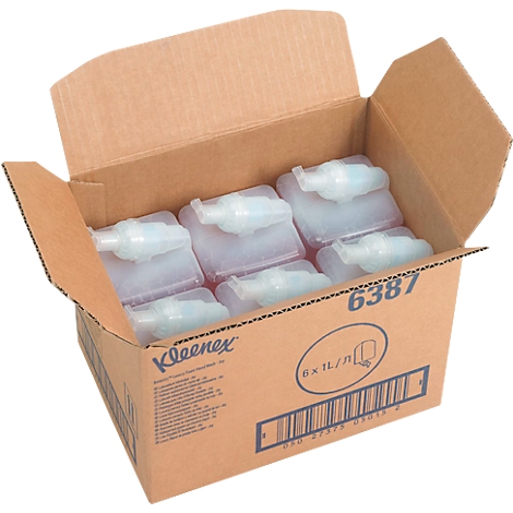 Karton met 6 Kleenex dispensers, gedeeltelijk geopend. Er staan logo's en tekst op de doos.