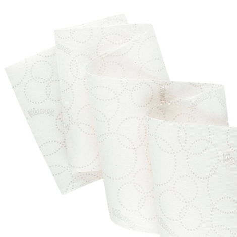 Close-up van wit tissuepapier met ingeprinte cirkels. Kleenex-logo.