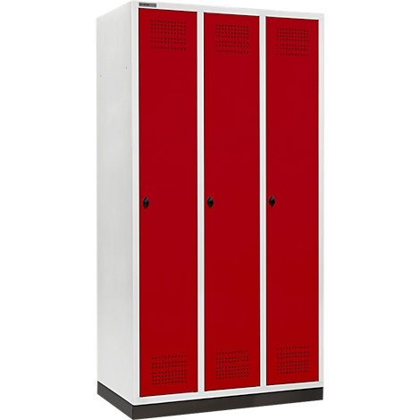 Ein weiß-roter Schrank mit drei Türen, mit schwarzen Griffen und Lüftungsschlitzen.