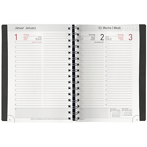 Un agenda ouvert avec une reliure spirale, ouvert à la première semaine de janvier 2022. Les jours sont numérotés et comportent des lignes pour prendre des notes.