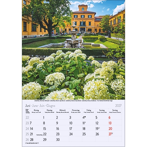 Calendrier montrant le mois de juin avec des fleurs, des bâtiments et une fontaine. L'année 2027 est visible sur le calendrier.